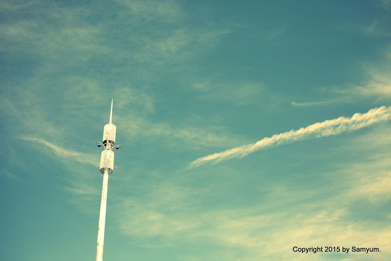 low angle view, communication, guidance, sky, street light, cloud - sky, direction, blue, lighting equipment, text, day, cloud, arrow symbol, outdoors, pole, directional sign, road sign, tower, no people, information sign