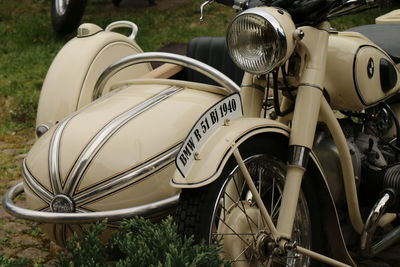 Close-up of bicycle parked on field