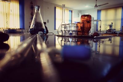 Surface level shot of laboratory glassware on table