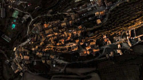 Spain, province of huesca, estopinan del castillo, aerial panorama of mountain town at dusk