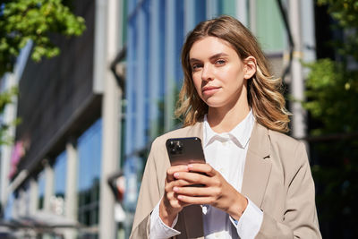 Young woman using mobile phone