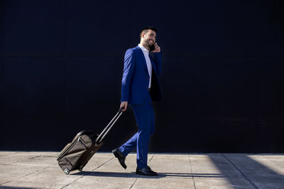 Businessman with suitcase taking a business trip