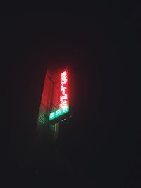 Low angle view of illuminated building at night