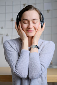 Portrait of young woman using mobile phone