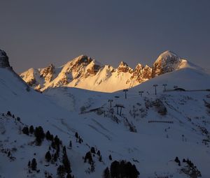 Scenic view of snowcapped mountains against clear sky