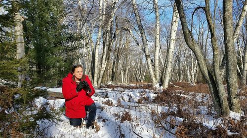 Portrait of woman on snow covered land