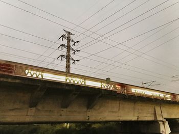 Low angle view of railway bridge against sky