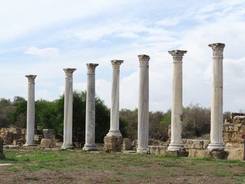Old ruins of temple against cloudy sky