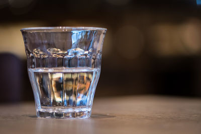 Close-up of drinking glass on table