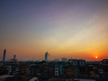 High angle view of buildings against sky during sunset