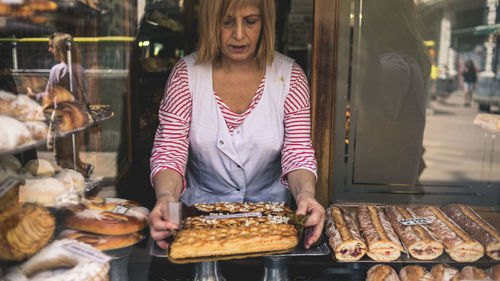 Woman standing at market stall