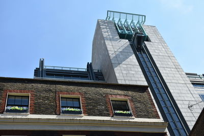 Low angle view of building against blue sky