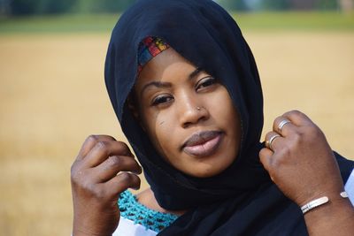 Close-up portrait of smiling young woman