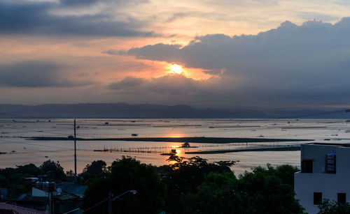 Scenic view of sea against orange sky