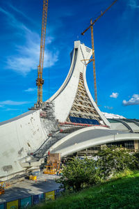 Low angle view of built structure against blue sky