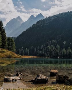 Scenic view of lake and mountains against sky