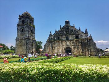 People in front of historical building