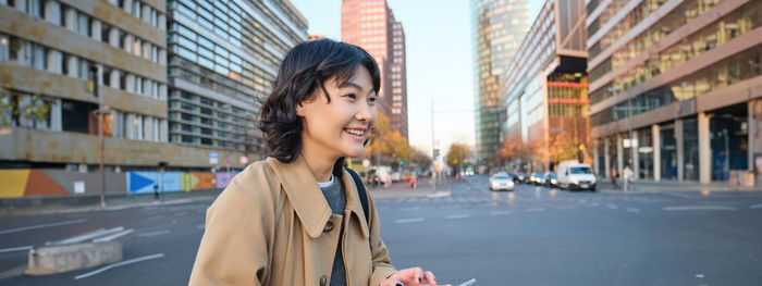 Young woman standing in city