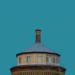 Low angle view of historical building against clear blue sky