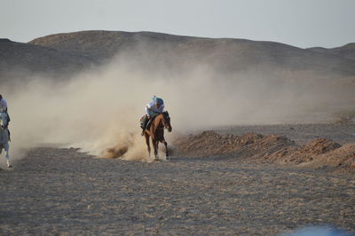 Full length of man on desert against sky