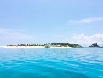 Scenic view of sea against blue sky