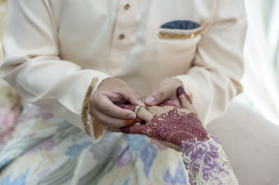 High angle view of woman holding hands