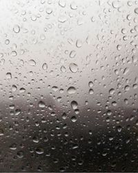 Close-up of water drops on glass