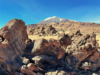 Panoramic view of rock formations against sky