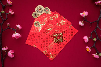 High angle view of red flower on table