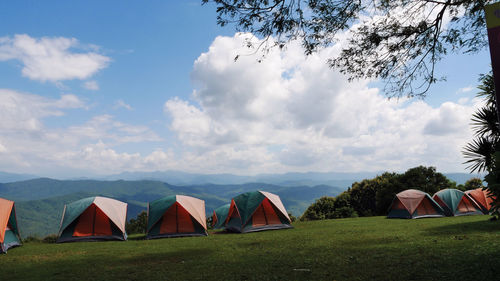 Tent on field against sky