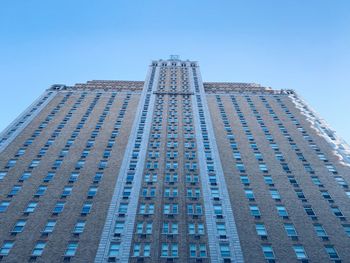 Low angle view of modern building against clear blue sky