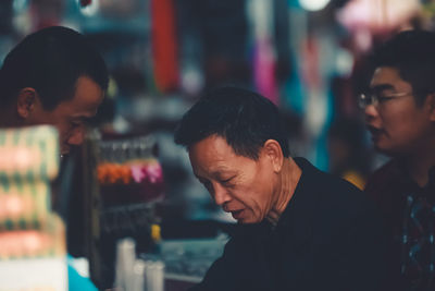 Portrait of a young man looking at outdoors
