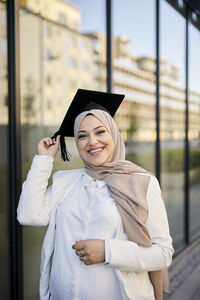 Smiling woman wearing graduation hat