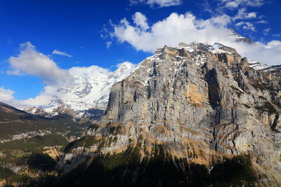 Low angle view of mountain range against sky