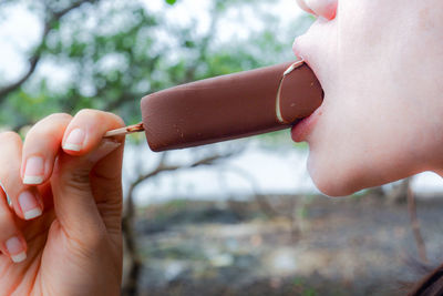 Close-up of woman eating ice cream