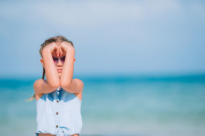 Portrait of woman in sea against sky