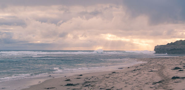 Scenic view of sea against cloudy sky