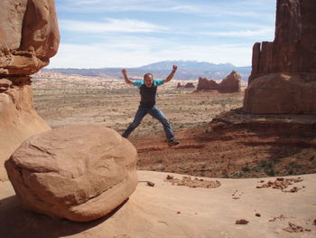 Person standing on rock formation