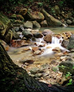 Scenic view of waterfall in river