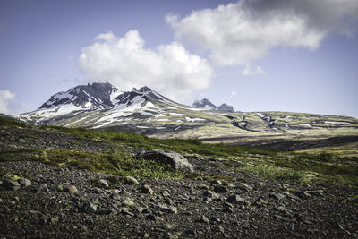 Scenic view of snow covered mountains against sky