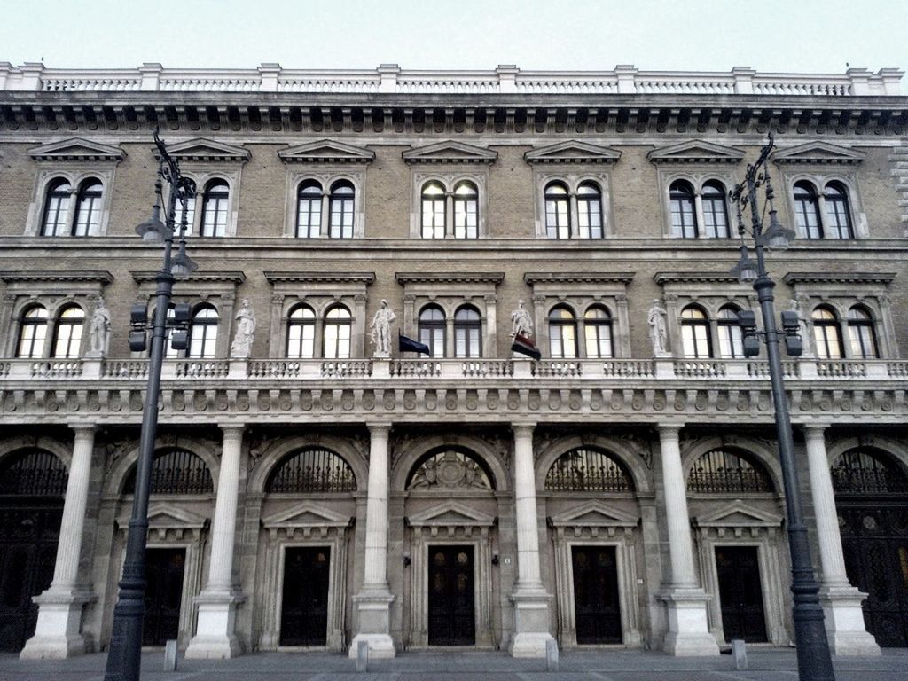 architecture, built structure, building exterior, window, arch, clear sky, low angle view, facade, building, in a row, history, residential building, city, day, balcony, outdoors, sky, old, no people, architectural column