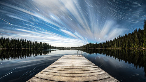 Scenic view of lake against sky at night