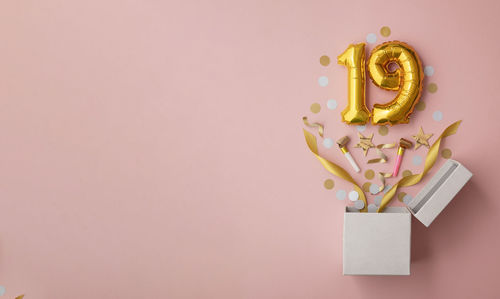 Close-up of christmas decoration on yellow background
