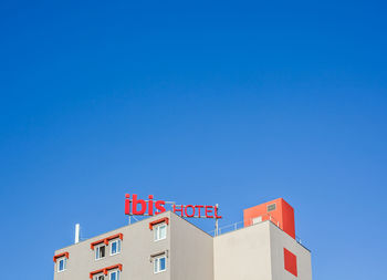 Low angle view of building against blue sky