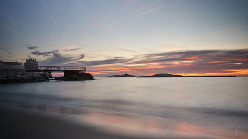 Scenic view of sea against sky during sunset