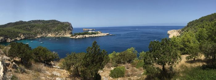 Scenic view of sea against clear blue sky