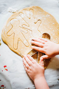 Child making gingerbread men