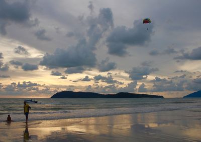 Scenic view of beach against sky during sunset