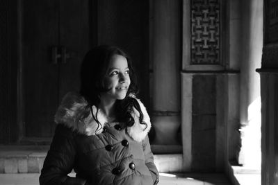 Portrait of young woman looking away