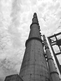 Low angle view of factory against sky